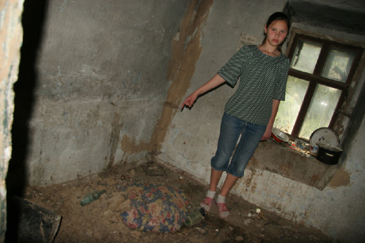 Katya shows Crossroads staff the squalid conditions of the home in which she lived with her brother before being fostered.