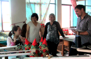 Global Handicrafts staff meet Lei Mei and other artisans on a trip to China.