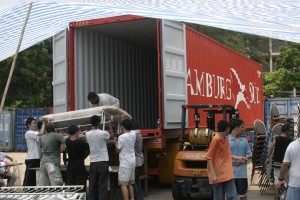 Goods for the hospital and school are loaded into the container at Crossroads in Hong Kong.